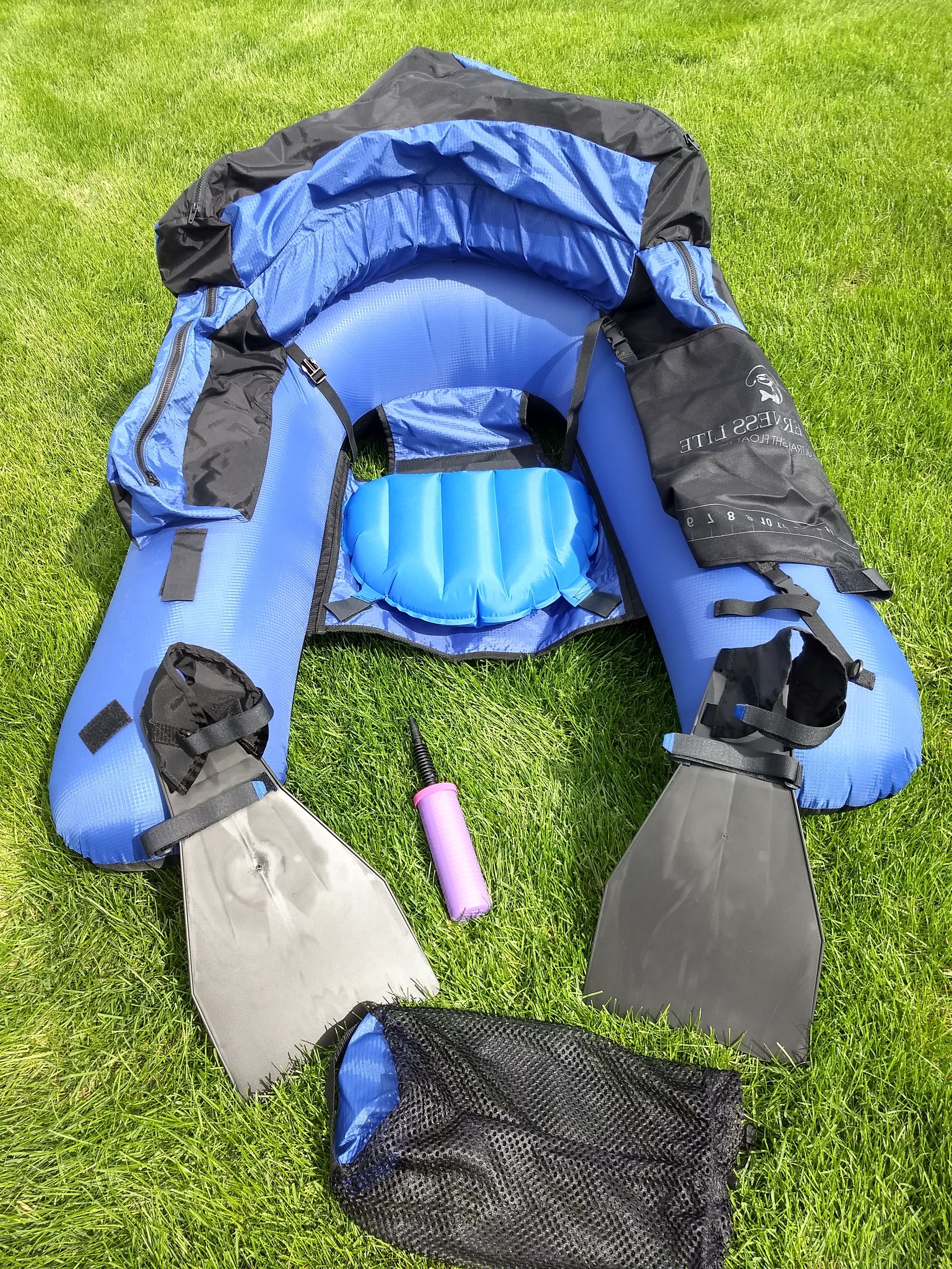 Picture of the Backpacker Pro complete ultralight float tube outfit with all its accessories and many features.  It includes Opti-Pack ultralight fins, Ice-Out inflatable seat, pump, & stuff sack sold at a discount.  This durable made in USA ultralight float tube comes with 3 inflation bladders, 3 zippered storage pockets, rod clamps, net clamp, 5 D rings, and a mesh apron for landing & measuring fish.